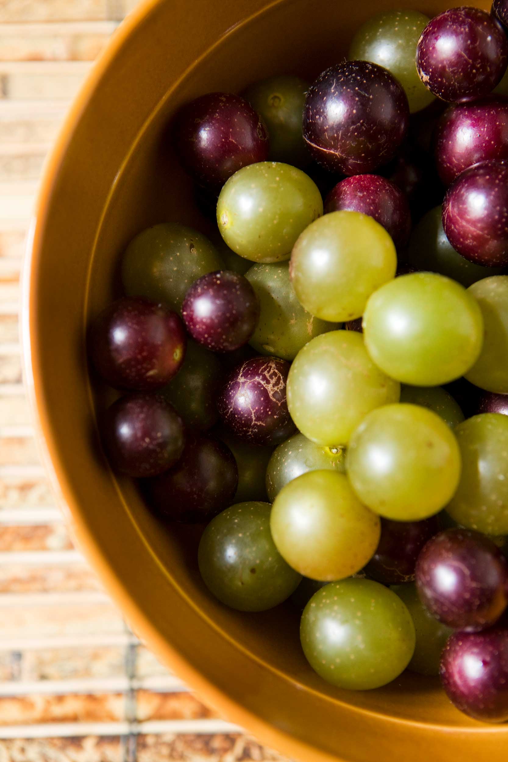 vertical-shot-of-muscadines-and-scuppernongs