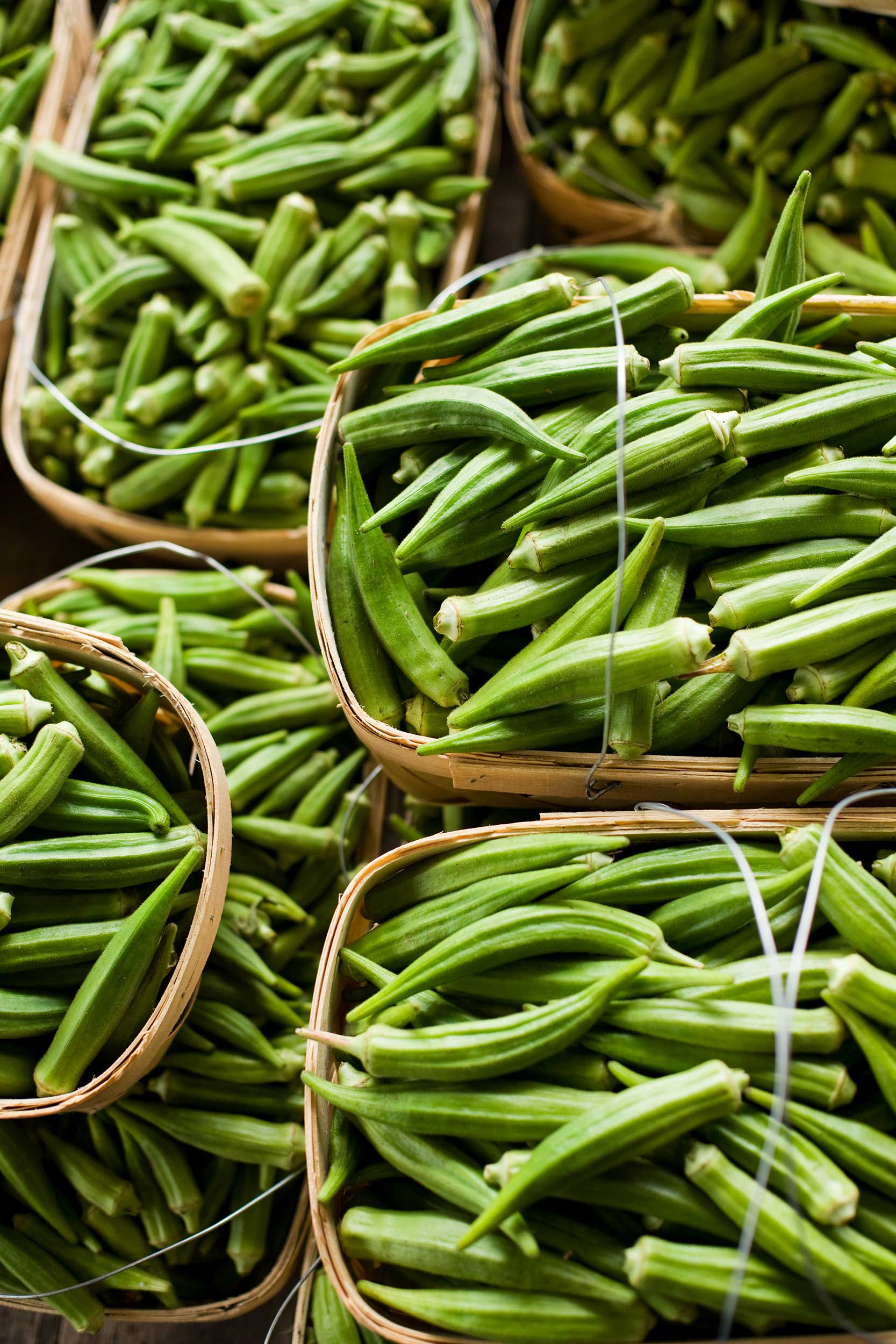vertical-shot-of-okra-in-baskets