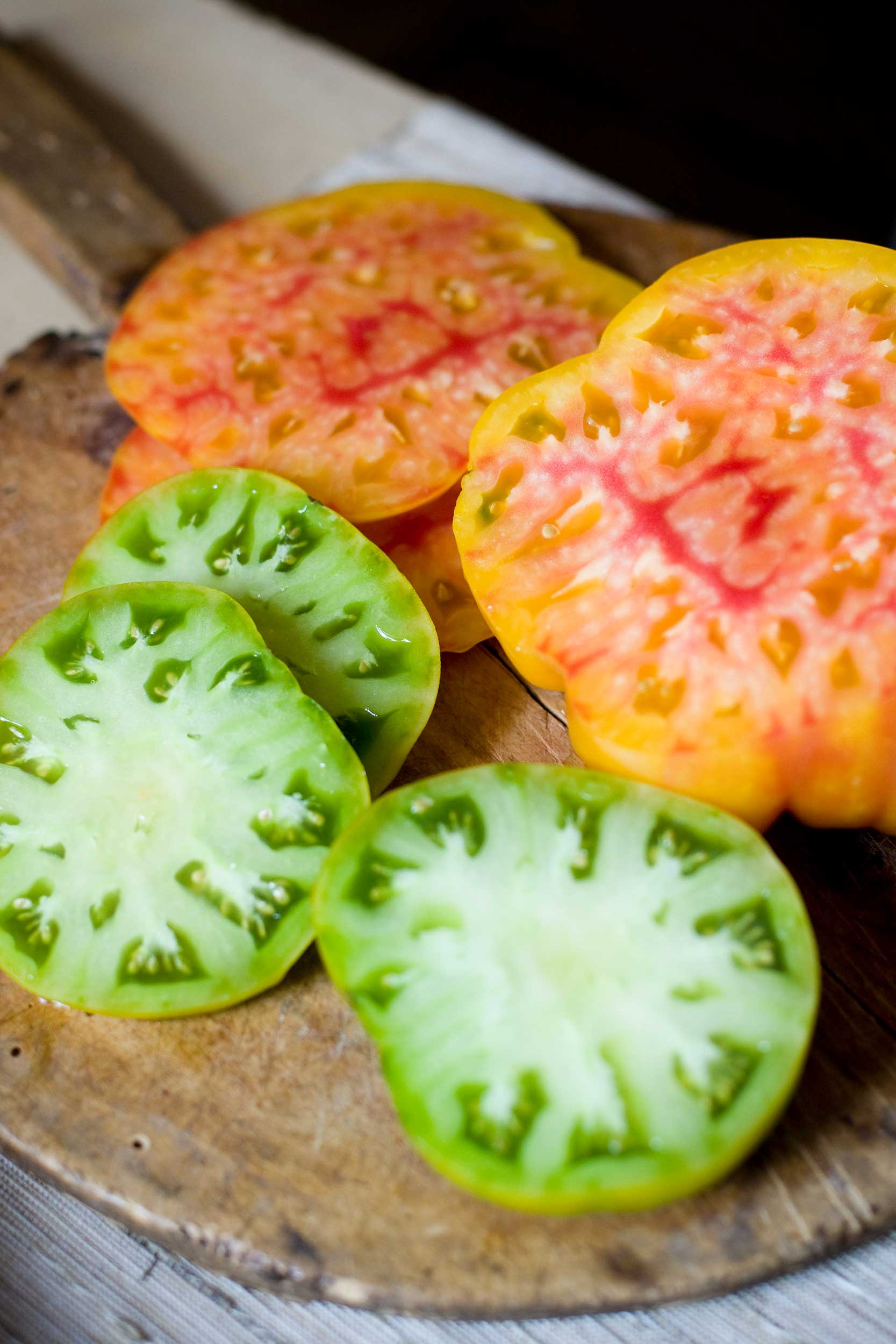 vertical-shot-of-sliced-heirloom-tomatoes
